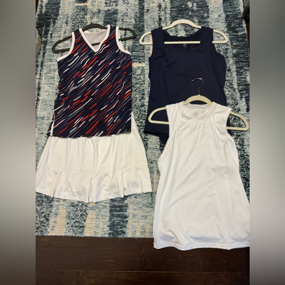 Tail tennis clothes. Navy and white combos. 3 shirts and 1 white skirt.